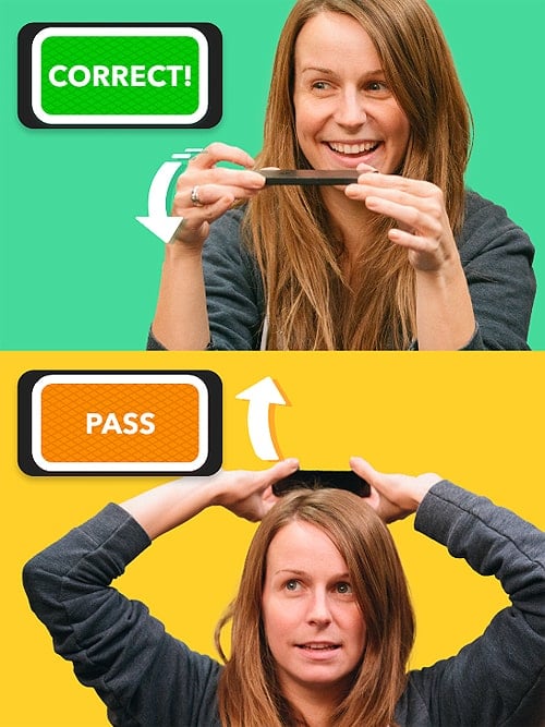 A screenshot of a woman lifting a cell phone over her head